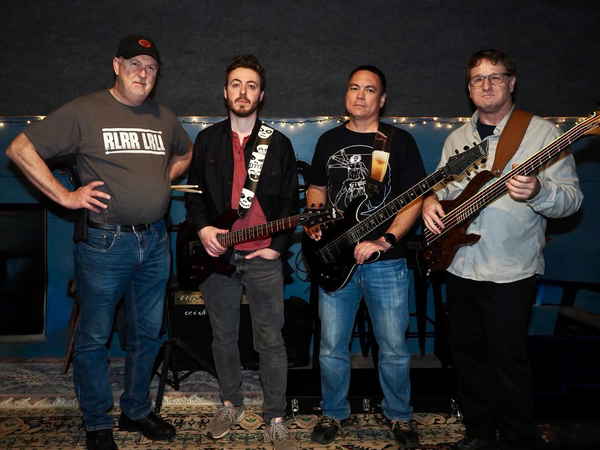 Sacramento 90s cover band members posing with their instruments before an event | Altus Entertainment